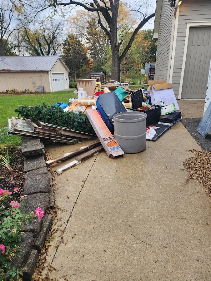 Dumpster being loaded with debris for 12 Yard Dumpster Rental in Placerville